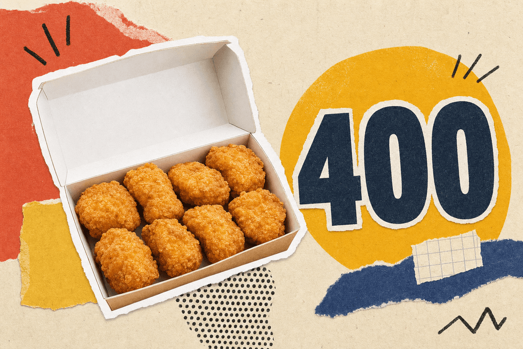 Eight fried chicken nugget pieces in a box with a calorie figure displayed